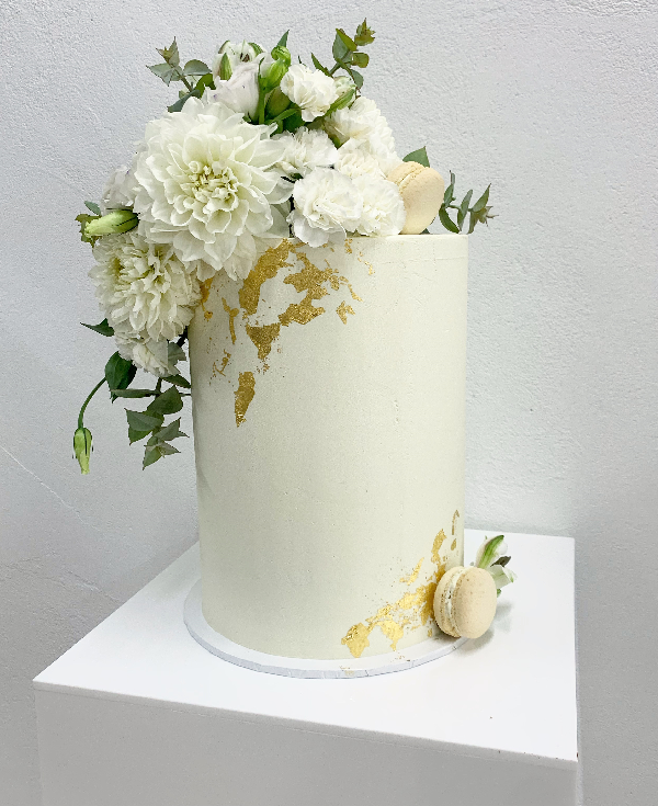 smooth white buttercream with gold foil